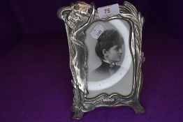 An art nouveau styled metal photo frame.