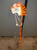 A wooden toy tiger hobby horse.