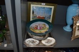 A collection of mixed items including a pair of frames, display plates and more.