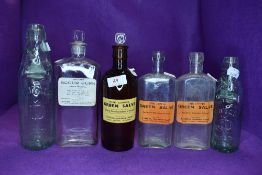 A selection of vintage medicine and drinks bottles.