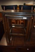 An early 20th Century nest of oak and ply occasional tables