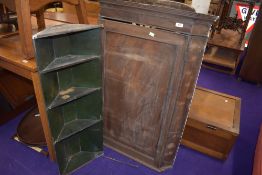 A 19th Century mahogany corner cupboard, in need of restoration , having painted green shelf