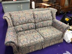 A vintage settee in floral upholstery