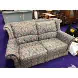 A vintage settee in floral upholstery