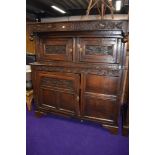 A period oak court cupboard, bears carved date 1697, further foliate and florette carving, width