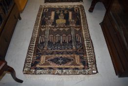 A Persian rug having temple style decoration, approx. 140 x 85cm