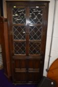 An Old Charm or Priory style dark stained corner display