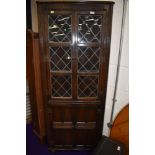 An Old Charm or Priory style dark stained corner display