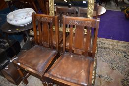 A set of four 1940s oak rail back dining chairs