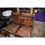 A set of four 1940s oak rail back dining chairs