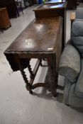 An early 20th Century oak twist gateleg dining table having piecrust style top