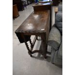 An early 20th Century oak twist gateleg dining table having piecrust style top