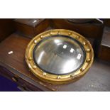 A gilt plaster wall mirror, of circular form, diameter approx. 39cm