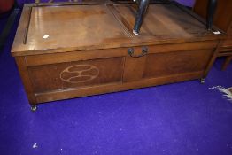 A mid 20th Century stained ply under bed style blanket box, with applique decoration and brass