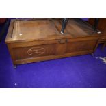 A mid 20th Century stained ply under bed style blanket box, with applique decoration and brass