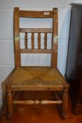 A 19th Century childrens spindle back rocking chair