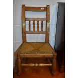 A 19th Century childrens spindle back rocking chair