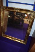 A modern gilt framed wall mirror, approx. 75 x 65cm