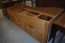 A single oak cabin bunk bed with two over one drawers and cupboard section. It is an exact cabin