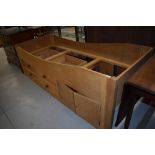 A single oak cabin bunk bed with two over one drawers and cupboard section. It is an exact cabin