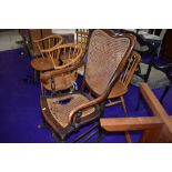 A 19th Century stained frame rocker having canework seat and back