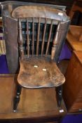 A 19th Century solid seat spindle back kitchen chair