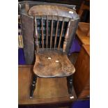 A 19th Century solid seat spindle back kitchen chair