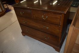 An early 20th Century mahogany and inlaid bedroom chest of two over two drawers