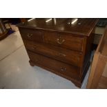 An early 20th Century mahogany and inlaid bedroom chest of two over two drawers