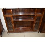 An early 20th Century mahogany bookcase, with narrow glazed display sections to each side, width