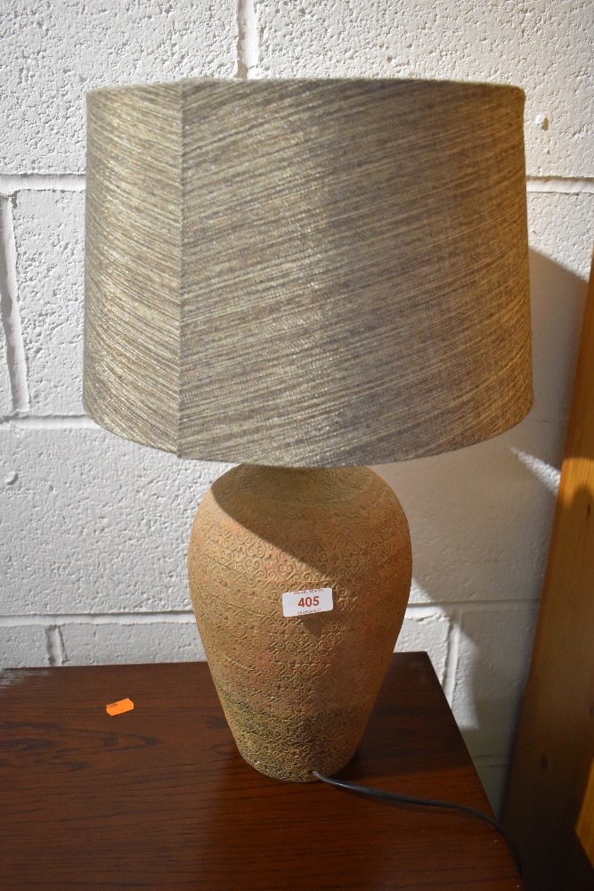 A pottery table lamp, with complimentary shade