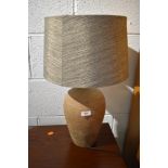 A pottery table lamp, with complimentary shade