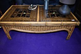 A modern bamboo and glass style coffee table