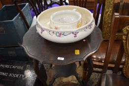 An early 20th Century stained frame occasional table having shaped top