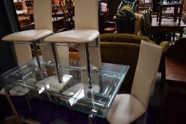 A modern glass extending dining table , having chrome frame and set of six complimenting chrome