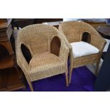 A pair of wicker tub chairs