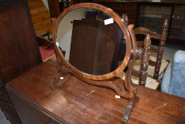 An early 20th Century mahogany toilet mirror
