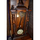 A 19th Century mahogany cased Vienna wall clock , includes plinth with Eagle finial