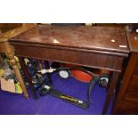 A Victorian mahogany fold over tea table, width approx. 86cm, depth 44cm