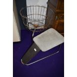 A vintage retail shop display basket and a shoe shop stool