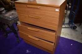 A vintage laminate (teak effect) bedroom chest of five long drawers, width approx. 77cm