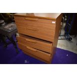 A vintage laminate (teak effect) bedroom chest of five long drawers, width approx. 77cm