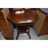 A late 19th/early 20th Century mahogany octagonal occasional table on part turned legs with