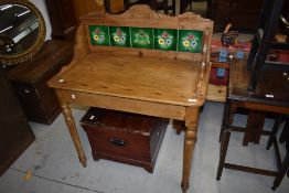 A 19th Century pine washstand having tile back