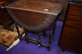 An early 20th Century oak twist gateleg occasional table