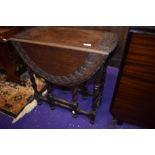 An early 20th Century oak twist gateleg occasional table