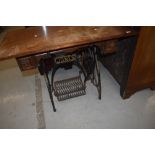 An Antique treadle Jones sewing machine base, with later wooden top