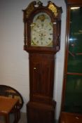 An early 19th Century mahogany cased long case clock gilt inlay and finial to top of hood , broken