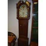 An early 19th Century mahogany cased long case clock gilt inlay and finial to top of hood , broken