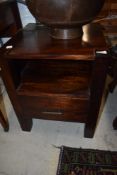 A modern hardwood bedside drawer with open shelf